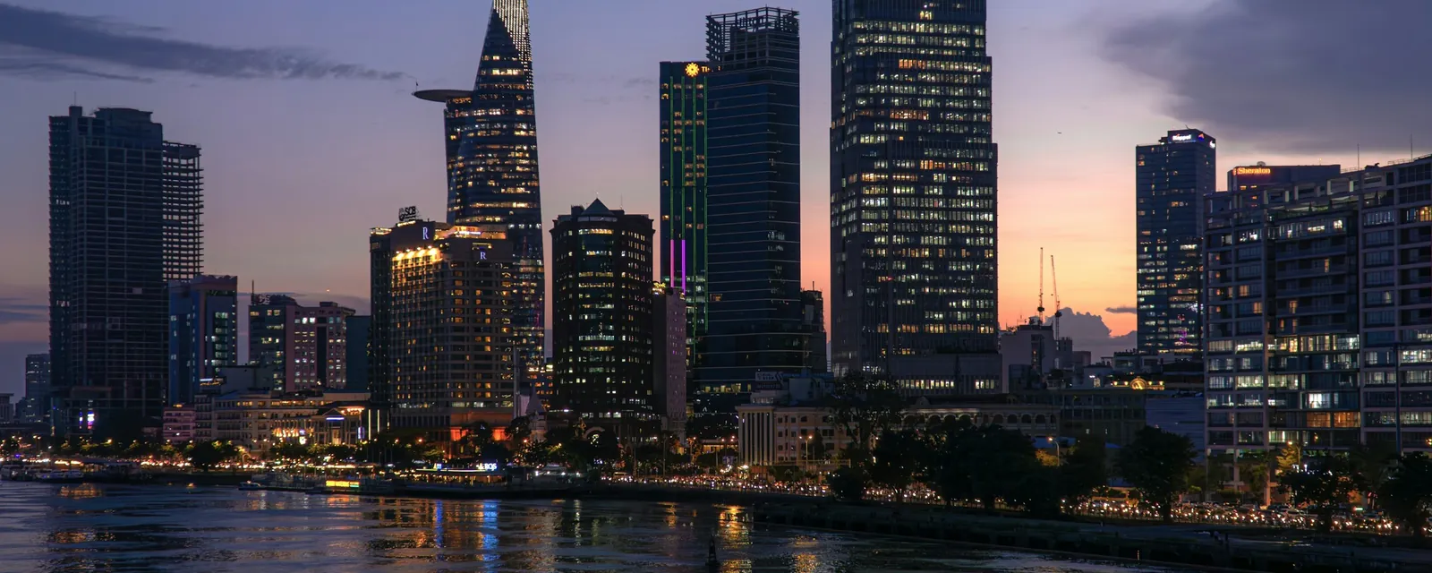 The Ho Chi Minh City skyline across the river at dusk