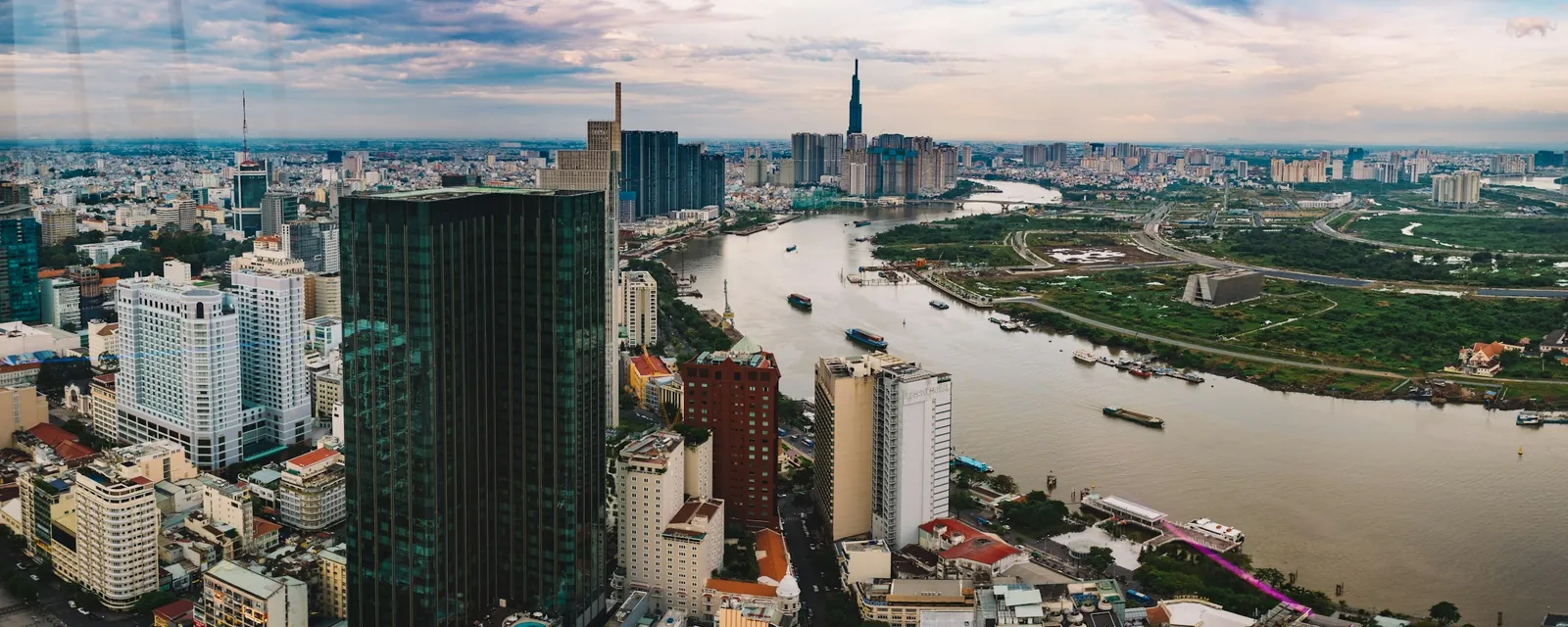 The Saigon River winding past central Ho Chi Minh City by day